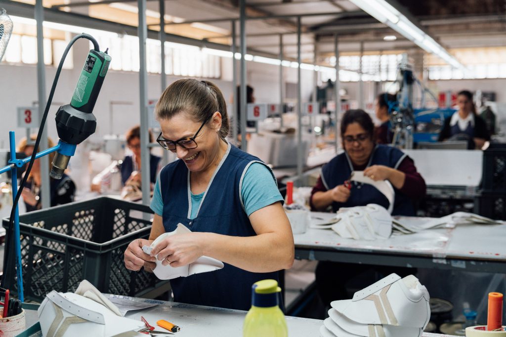 Factory worker smiling during the work.