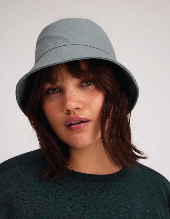 Bucket Hats You Will Want To Wear All Summer. Grey bucket hat from sustainable brand Girlfriend Collective.