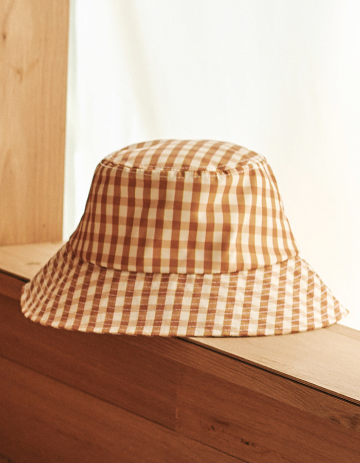 Bucket Hats You Will Want To Wear All Summer. Beige check hat from Loeffler Randall.