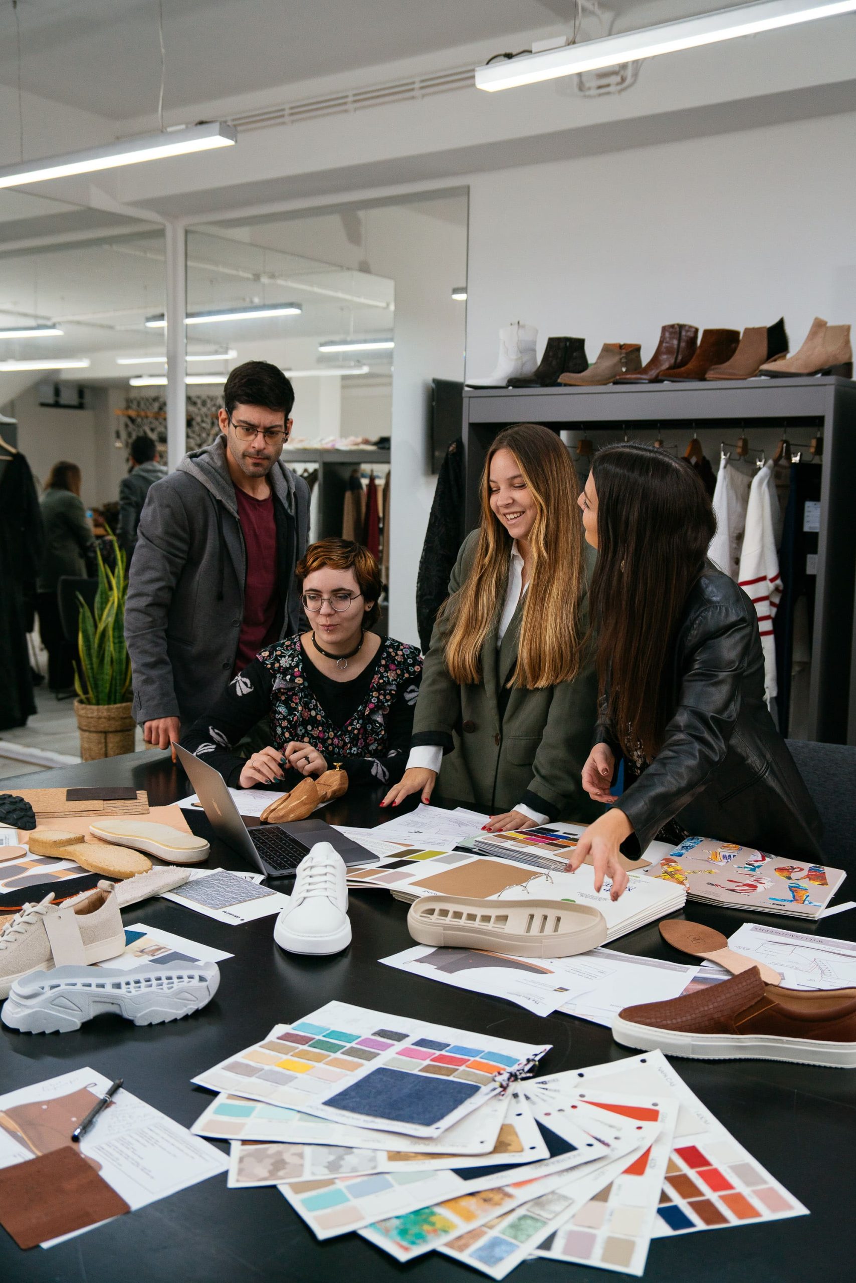 Team of people working on a shoe project.