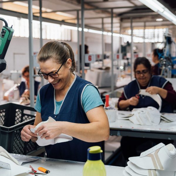 Factory worker smiling during the work.