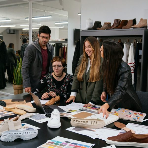 Team of people working on a shoe project.